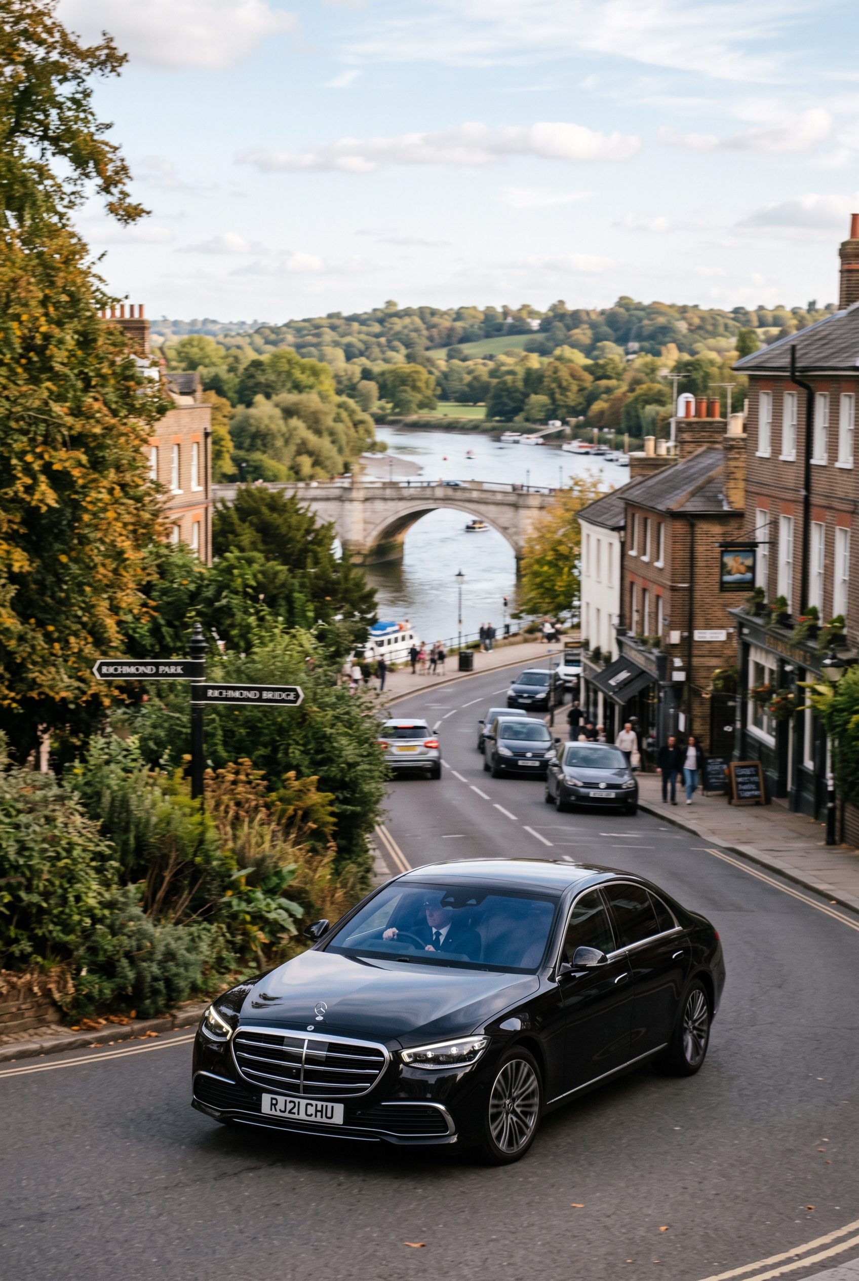 Private hire vehicle travelling through a town area